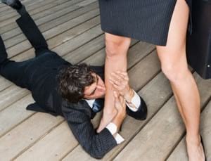 Businessman Kissing Businesswoman's Leg